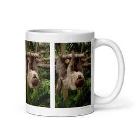 11 oz. white ceramic sloth mug showing a sloth in its natural habitat