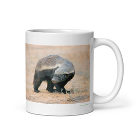 11 oz. white ceramic honey badger mug showing a honey badger in its natural habitat