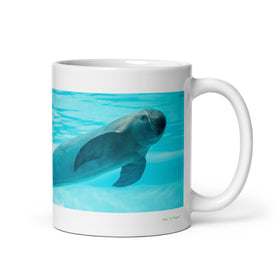 11 oz. white ceramic porpoise mug showing a porpoise in its natural habitat