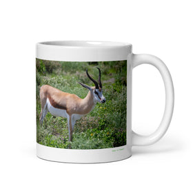 11 oz. white ceramic springbok mug showing a springbok in its natural habitat