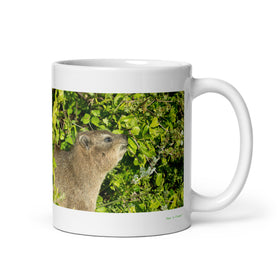 11 oz. white ceramic hyrax mug showing a hyrax in its natural habitat