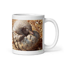 11 oz. white ceramic pangolin mug showing a pangolin in its natural habitat