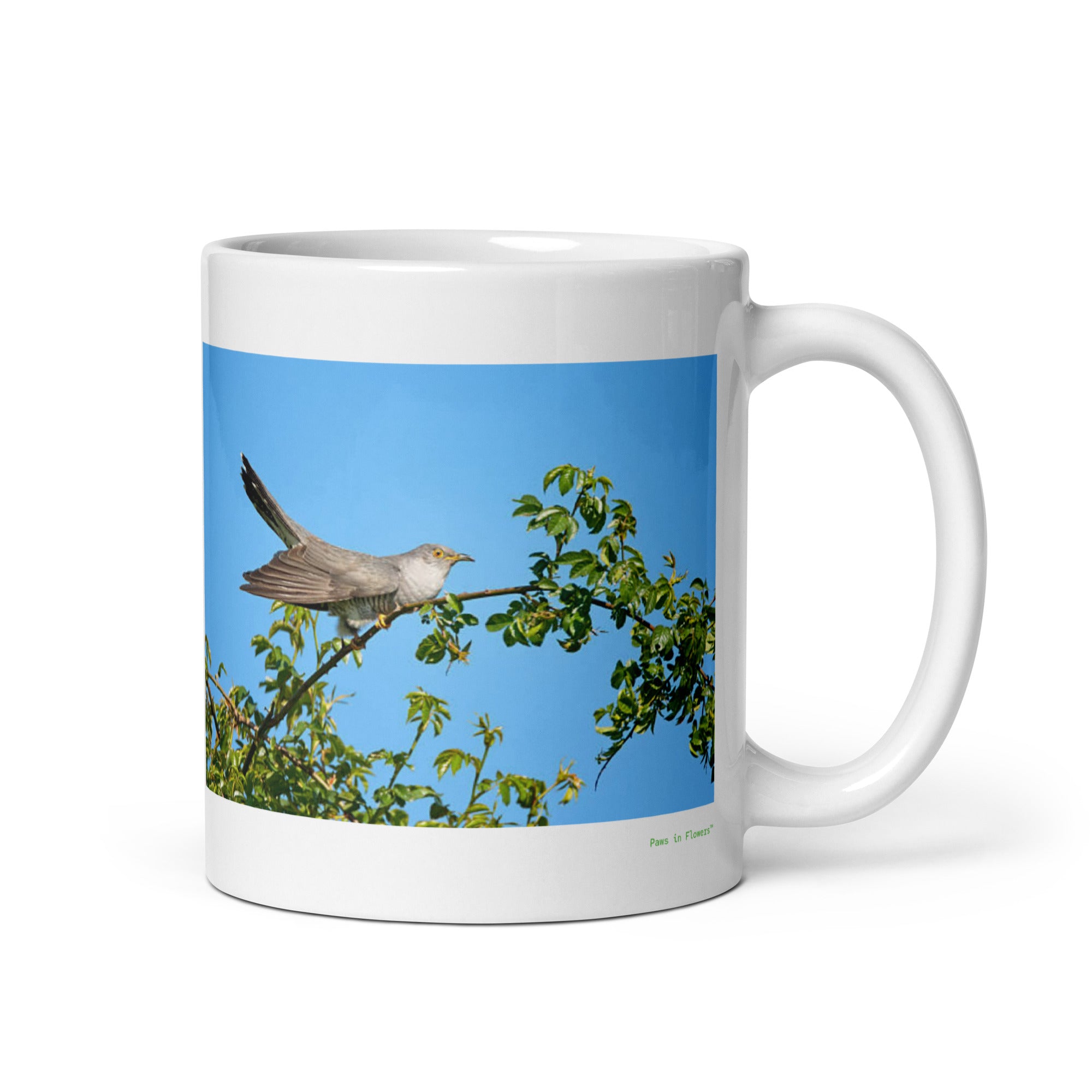 11 oz. white ceramic cuckoo mug showing a cuckoo in its natural habitat