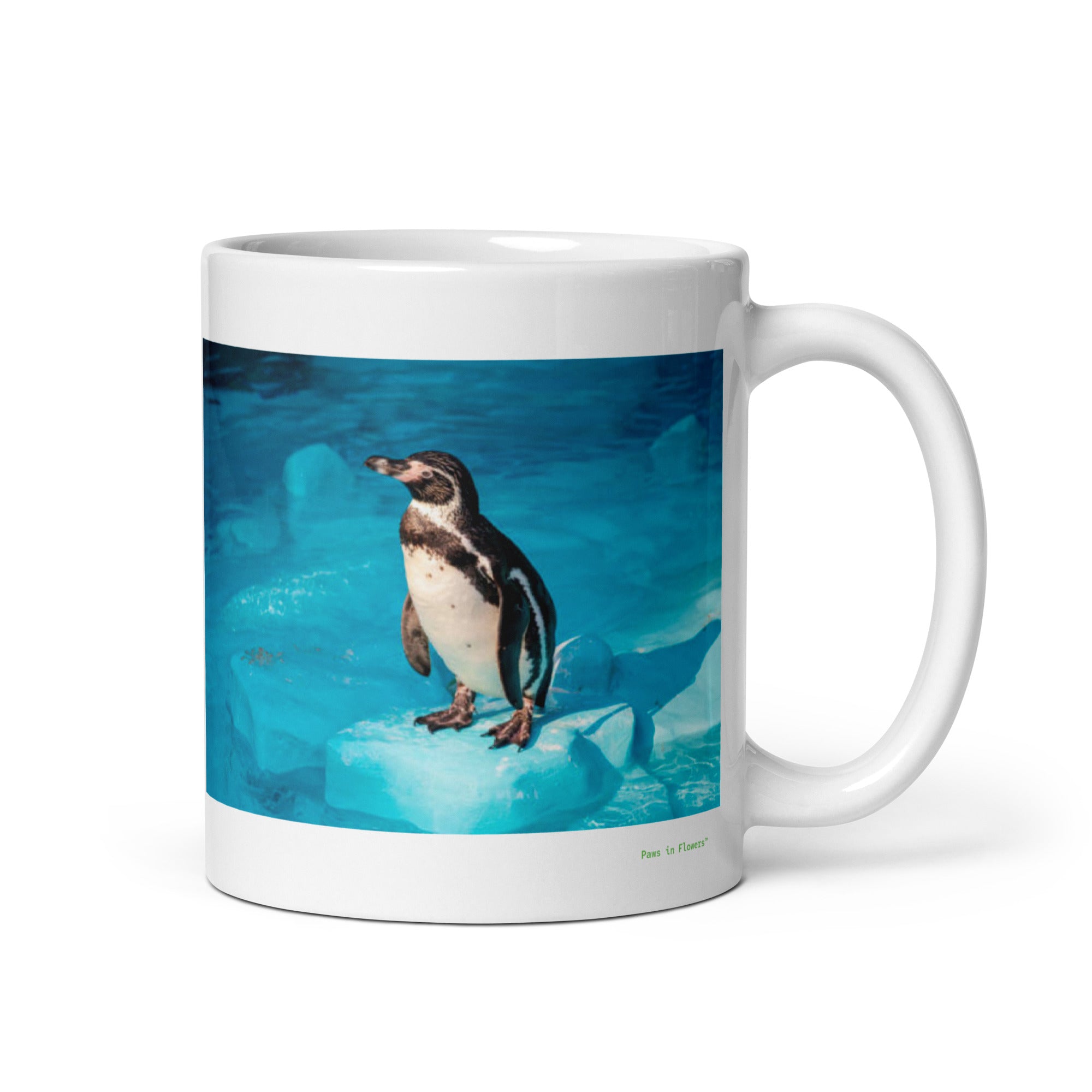 11 oz. white ceramic penguin mug showing a penguin in its natural habitat