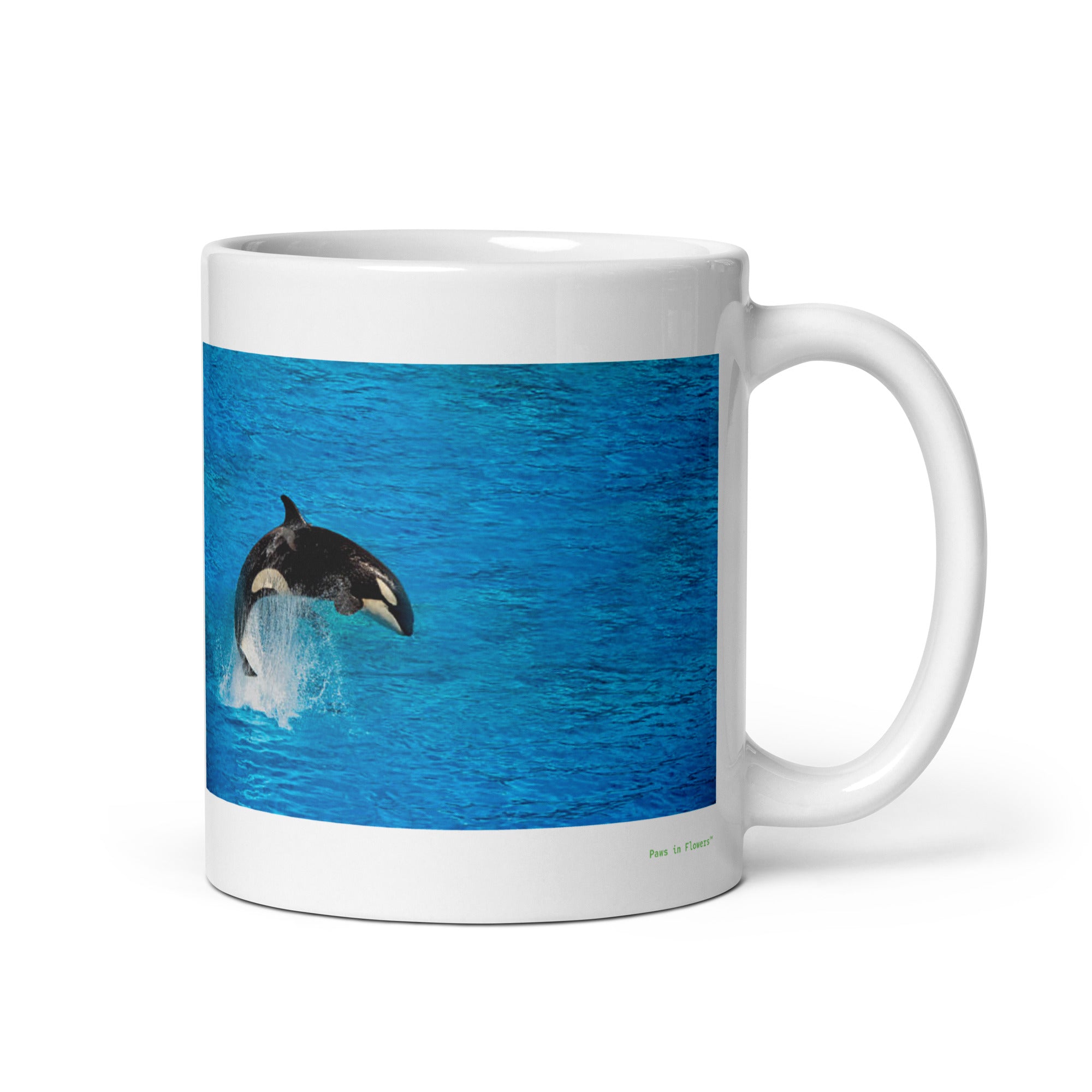 11 oz. white ceramic orca whale mug showing an orca whale in its natural habitat