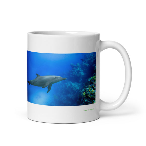 11 oz. white ceramic dolphin mug showing a dolphin in its natural habitat