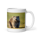 11 oz. white ceramic wombat mug showing a wombat in its natural habitat