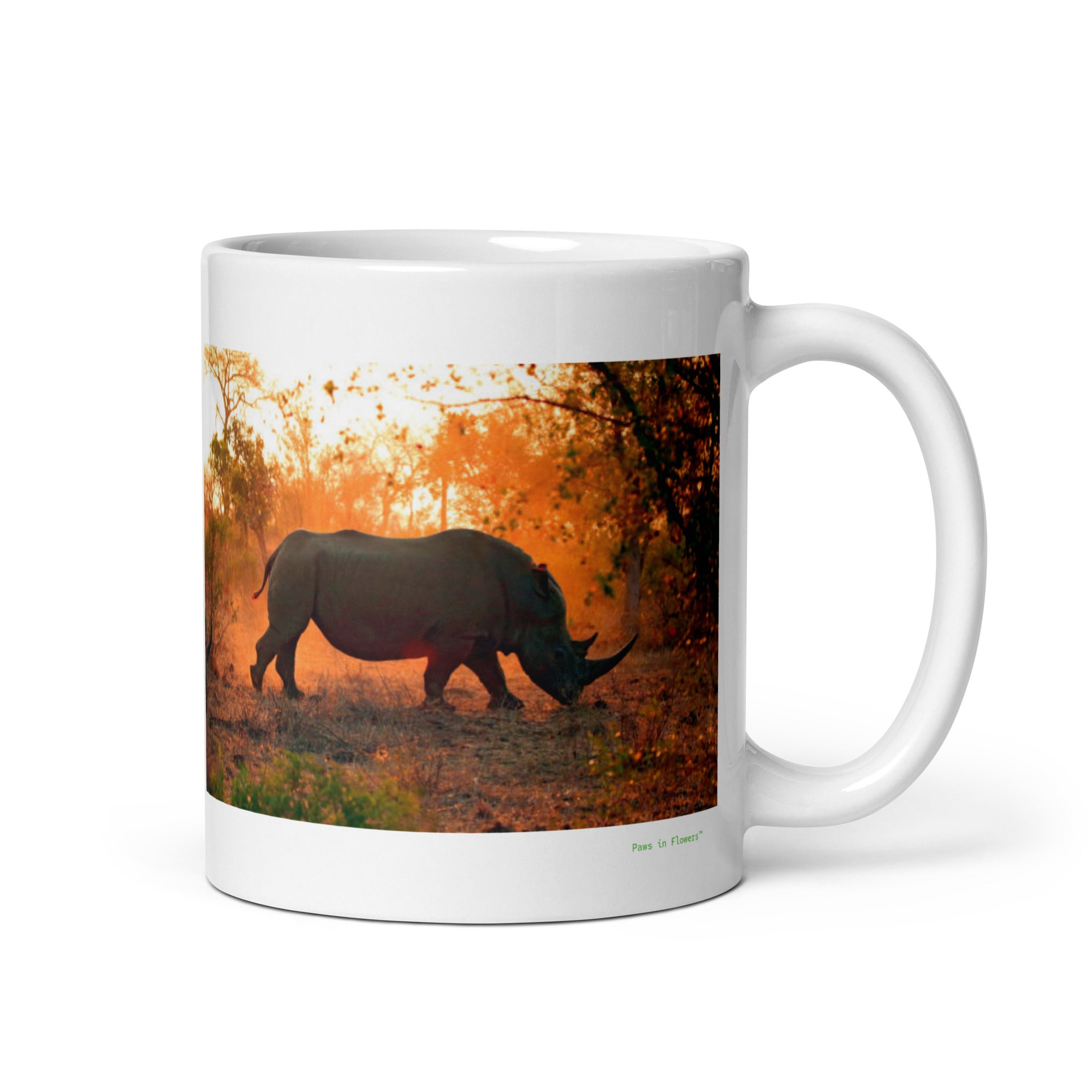 11 oz. white ceramic rhinoceros mug showing a rhinoceros in its natural habitat