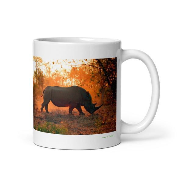 11 oz. white ceramic rhinoceros mug showing a rhinoceros in its natural habitat
