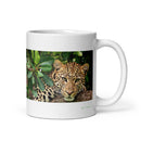 11 oz. white ceramic leopard mug showing a leopard in its natural habitat