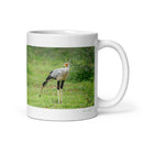 11 oz. white ceramic secretary bird mug showing a secretary bird in its natural habitat