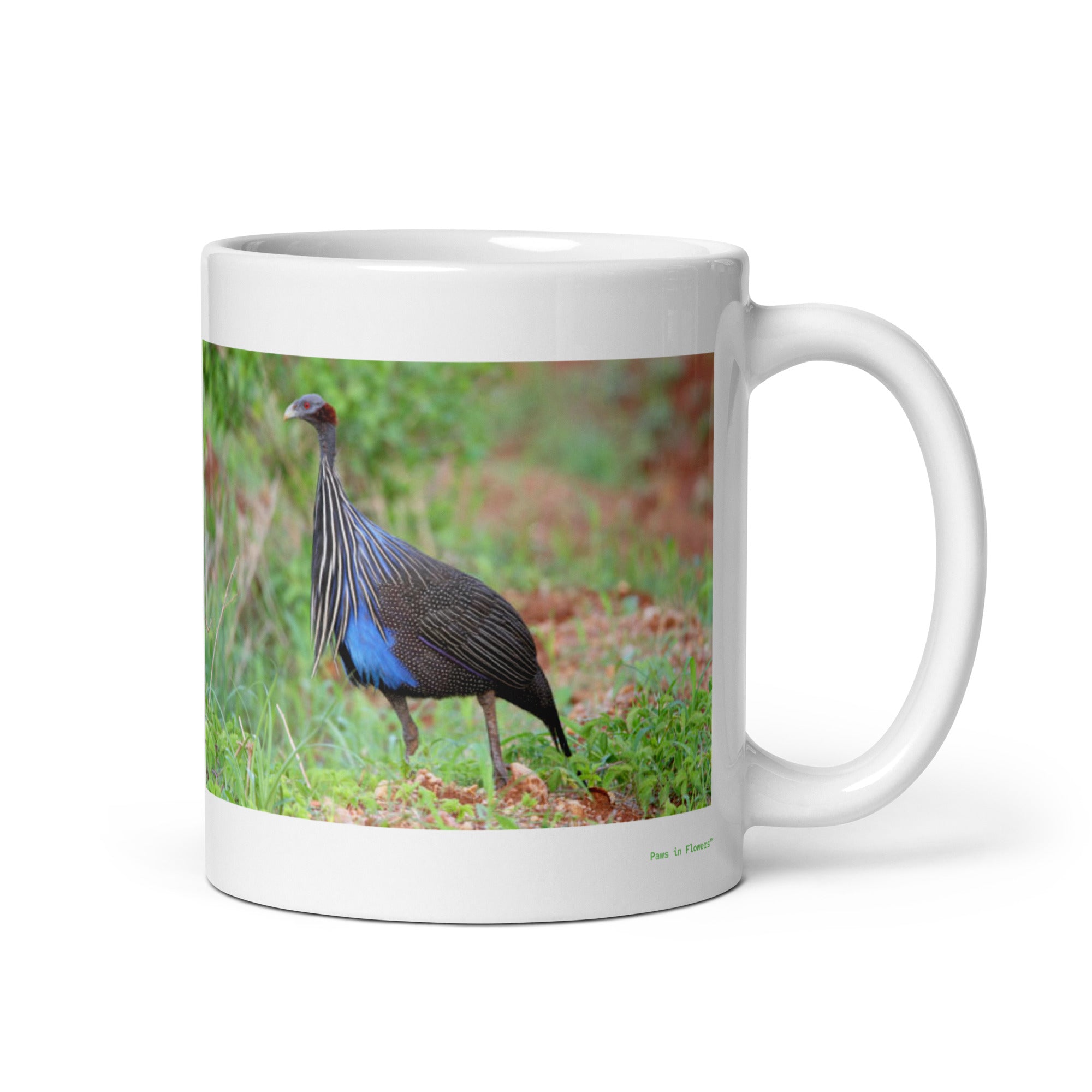 11 oz. white ceramic guinea fowl mug showing a guinea fowl in its natural habitat