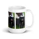 15 oz. white ceramic skunk mug showing a skunk in its natural habitat