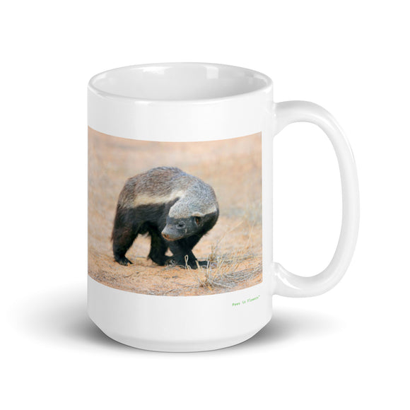 15 oz. white ceramic honey badger mug showing a honey badger in its natural habitat