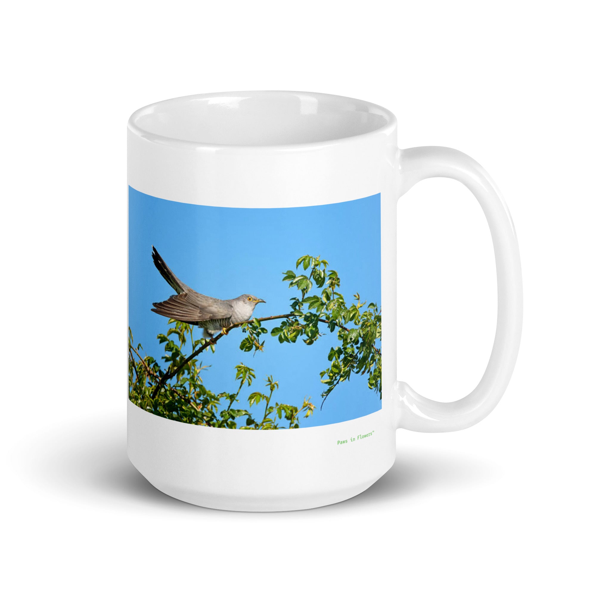 15 oz. white ceramic cuckoo mug showing a cuckoo in its natural habitat