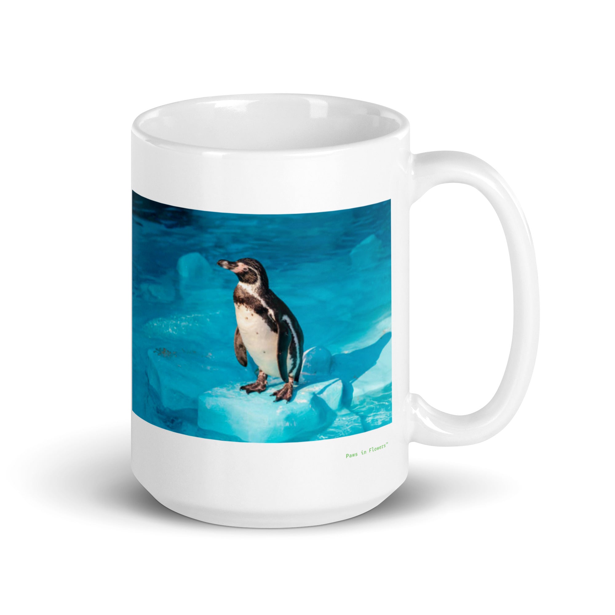 15 oz. white ceramic penguin mug showing a penguin in its natural habitat