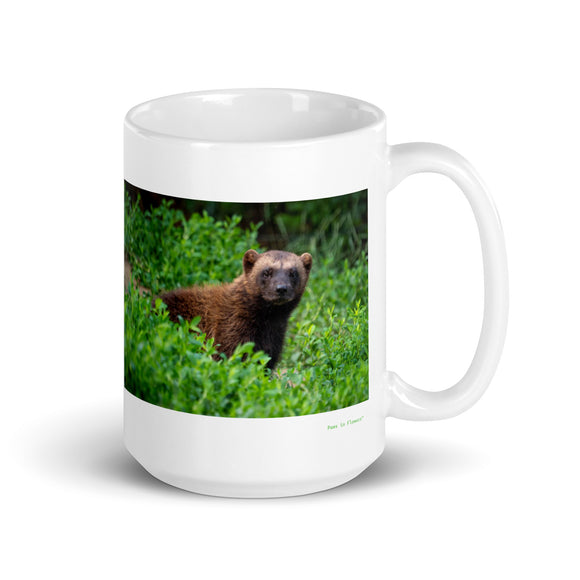 15 oz. white ceramic wolverine animal mug showing a wolverine animal in its natural habitat