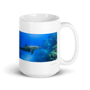 15 oz. white ceramic dolphin mug showing a dolphin in its natural habitat