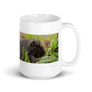 15 oz. white ceramic porcupine mug showing a porcupine in its natural habitat