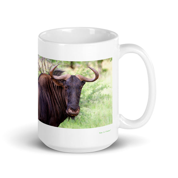 15 oz. white ceramic wildebeest mug showing a wildebeest in its natural habitat