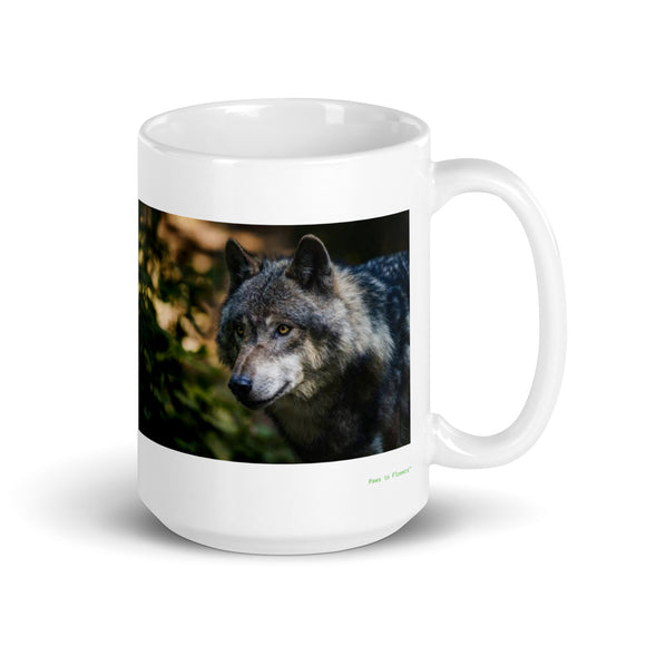 15 oz. white ceramic wolf mug showing a wolf in its natural habitat