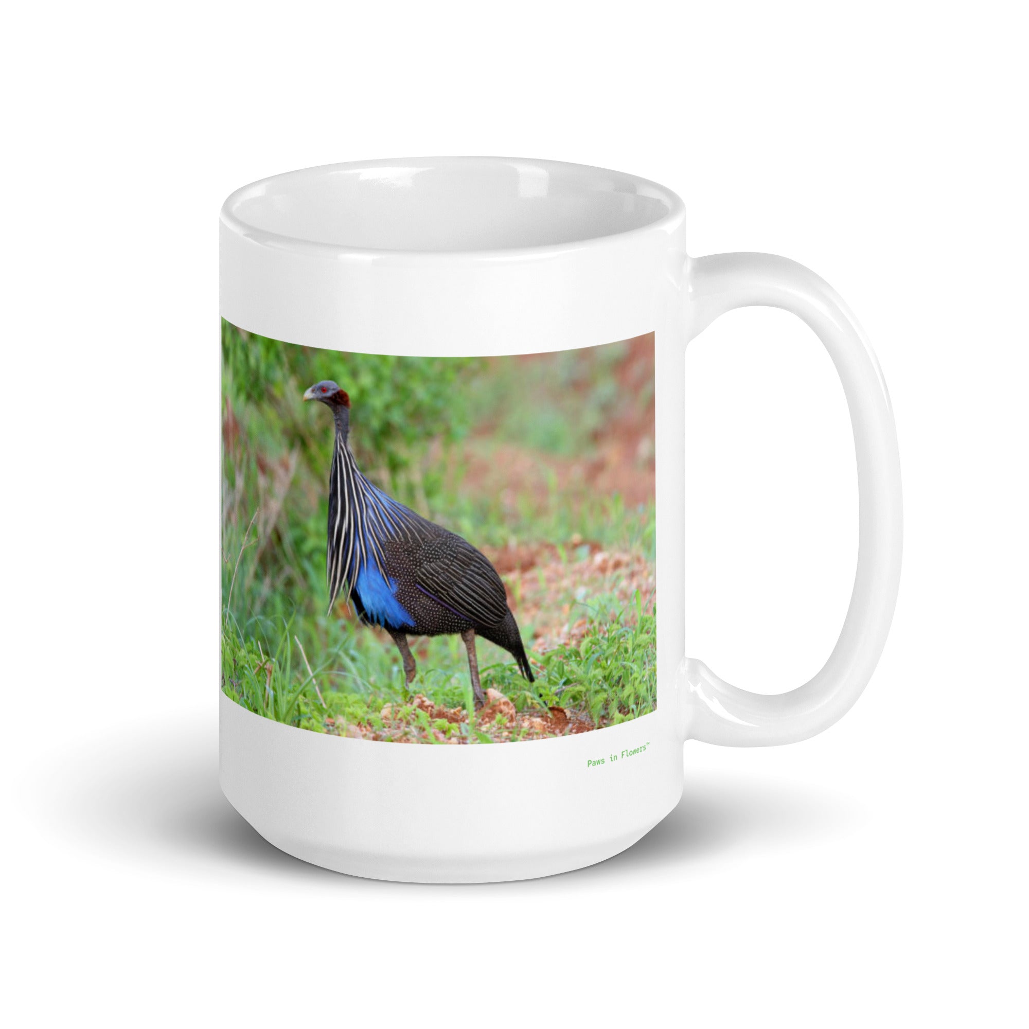 15 oz. white ceramic guinea fowl mug showing a guinea fowl in its natural habitat