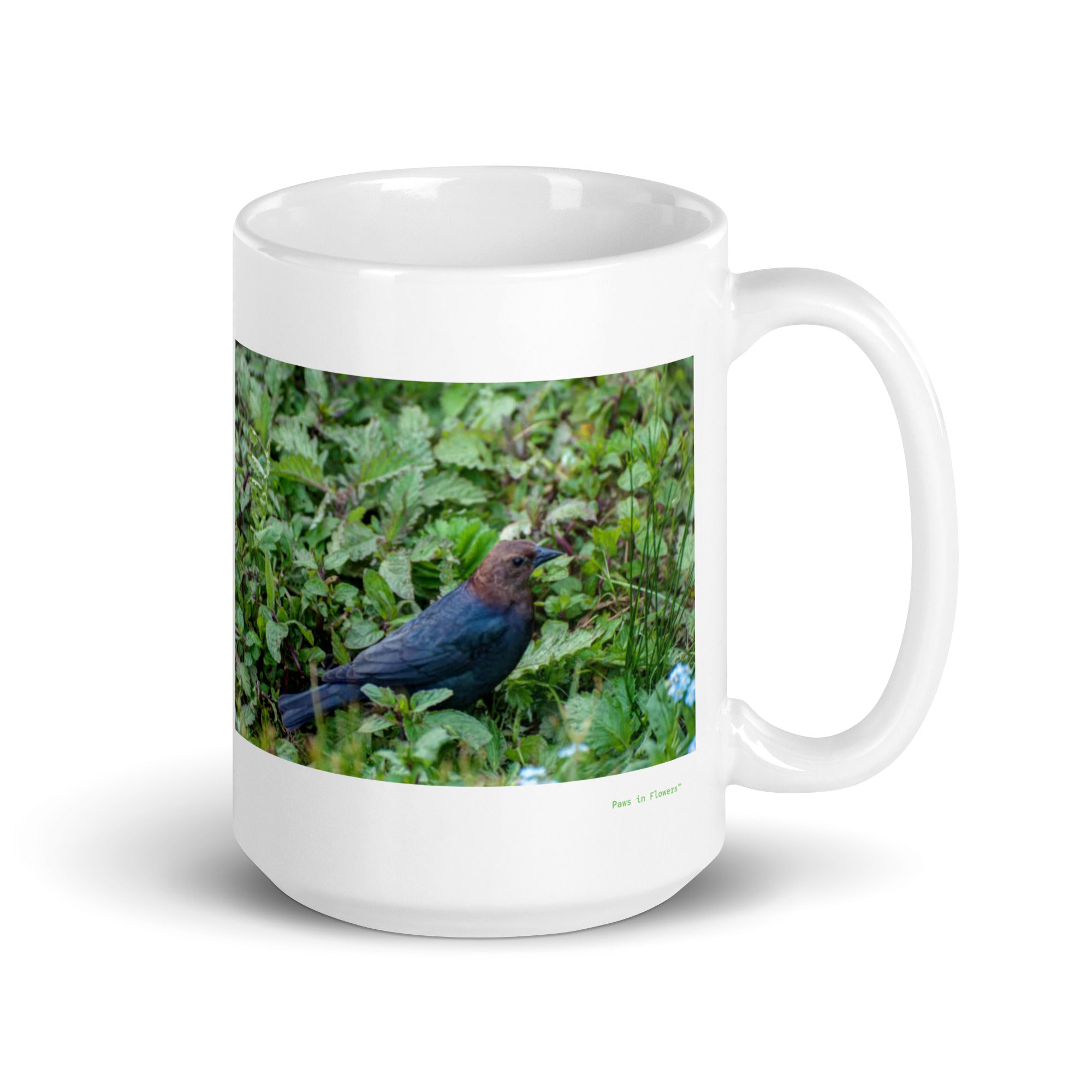 15 oz. white ceramic cowbird  mug showing a cowbird in its natural habitat