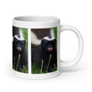 20 oz. white ceramic skunk mug showing a skunk in its natural habitat