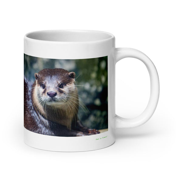 20 oz. white ceramic otter mug showing an otter in its natural habitat