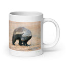 20 oz. white ceramic honey badger mug showing a honey badger in its natural habitat