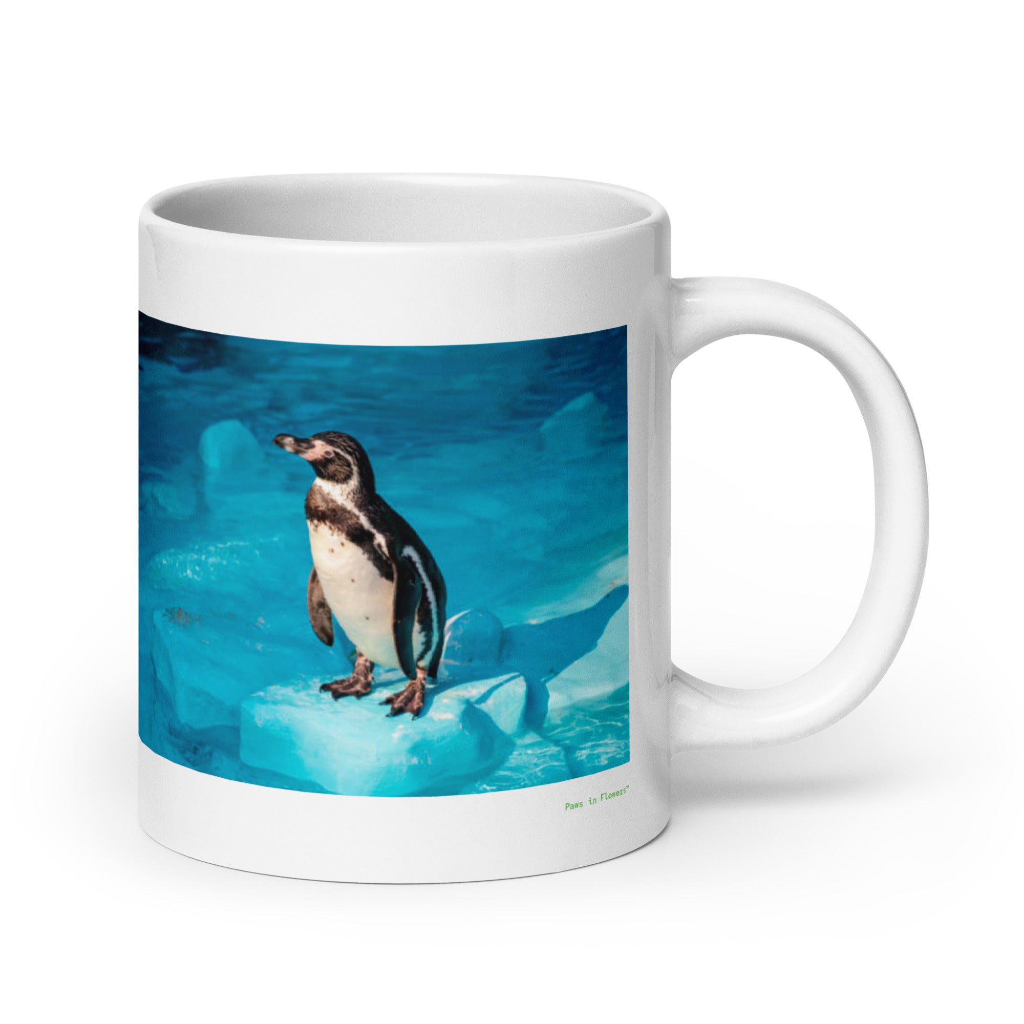 20 oz. white ceramic penguin mug showing a penguin in its natural habitat