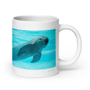 20 oz. white ceramic porpoise mug showing a porpoise in its natural habitat