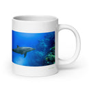 20 oz. white ceramic dolphin mug showing a dolphin in its natural habitat