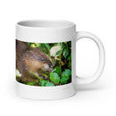 20 oz. white ceramic muskrat mug showing a muskrat in its natural habitat