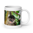 20 oz. white ceramic spider monkey mug showing a spider monkey in its natural habitat