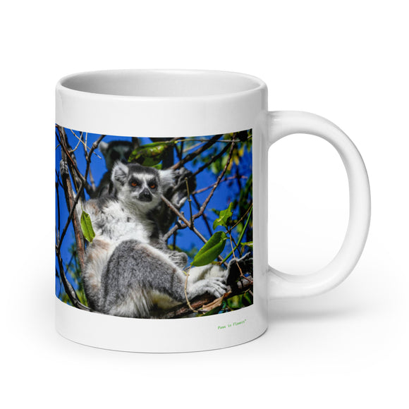 20 oz. white ceramic lemur mug showing a lemur in its natural habitat