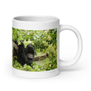 20 oz. white ceramic howler monkey mug showing a howler monkey in its natural habitat