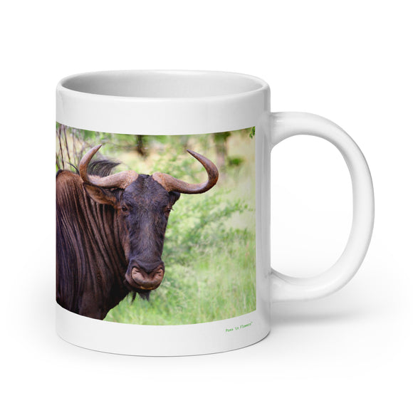 20 oz. white ceramic wildebeest mug showing a wildebeest in its natural habitat