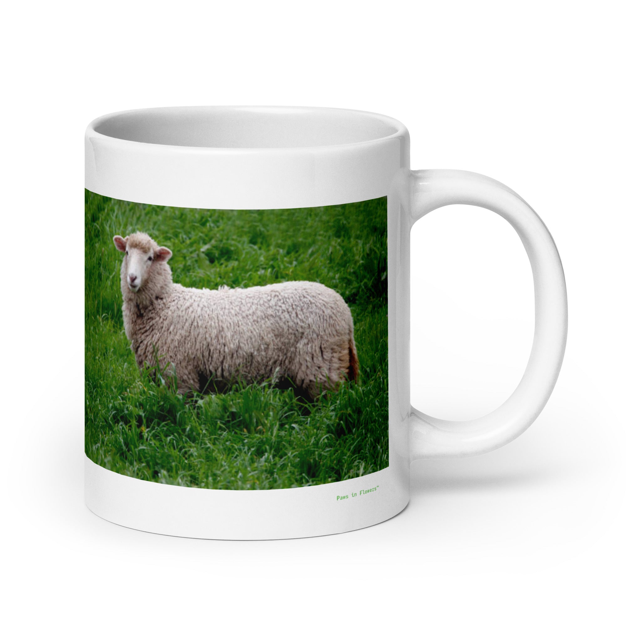 20 oz. white ceramic sheep mug showing a sheep in its natural habitat