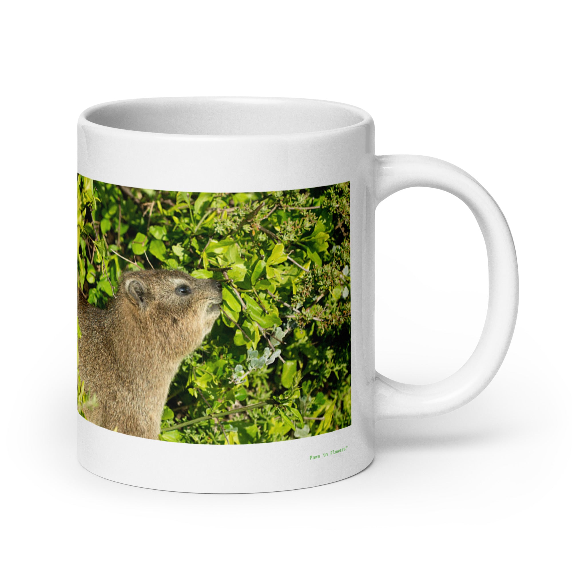 20 oz. white ceramic hyrax mug showing a hyrax in its natural habitat