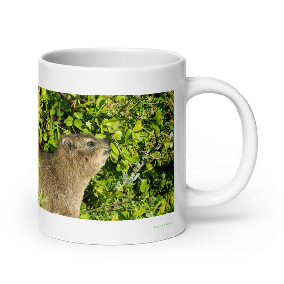 20 oz. white ceramic hyrax mug showing a hyrax in its natural habitat