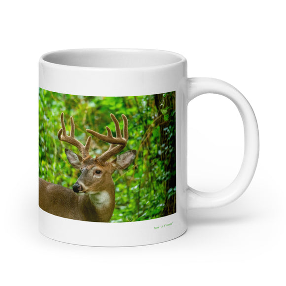 20 oz. white ceramic deer mug showing a deer in its natural habitat