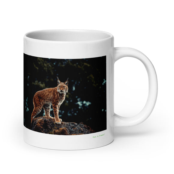 20 oz. white ceramic lynx mug showing a lynx in its natural habitat