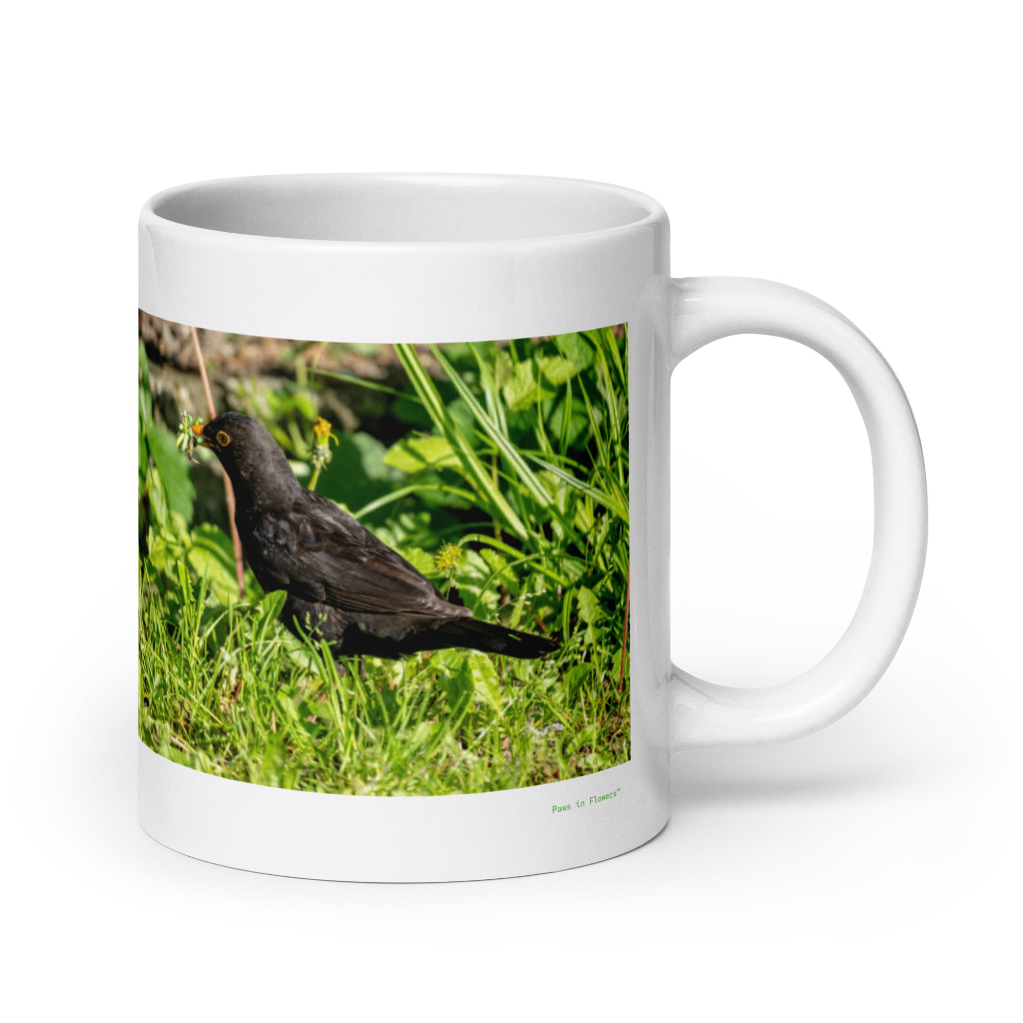 20 oz. white ceramic blackbird mug showing a blackbird in its natural habitat