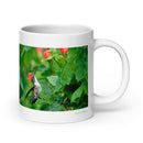 20 oz. white ceramic hummingbird mug showing a hummingbird in its natural habitat
