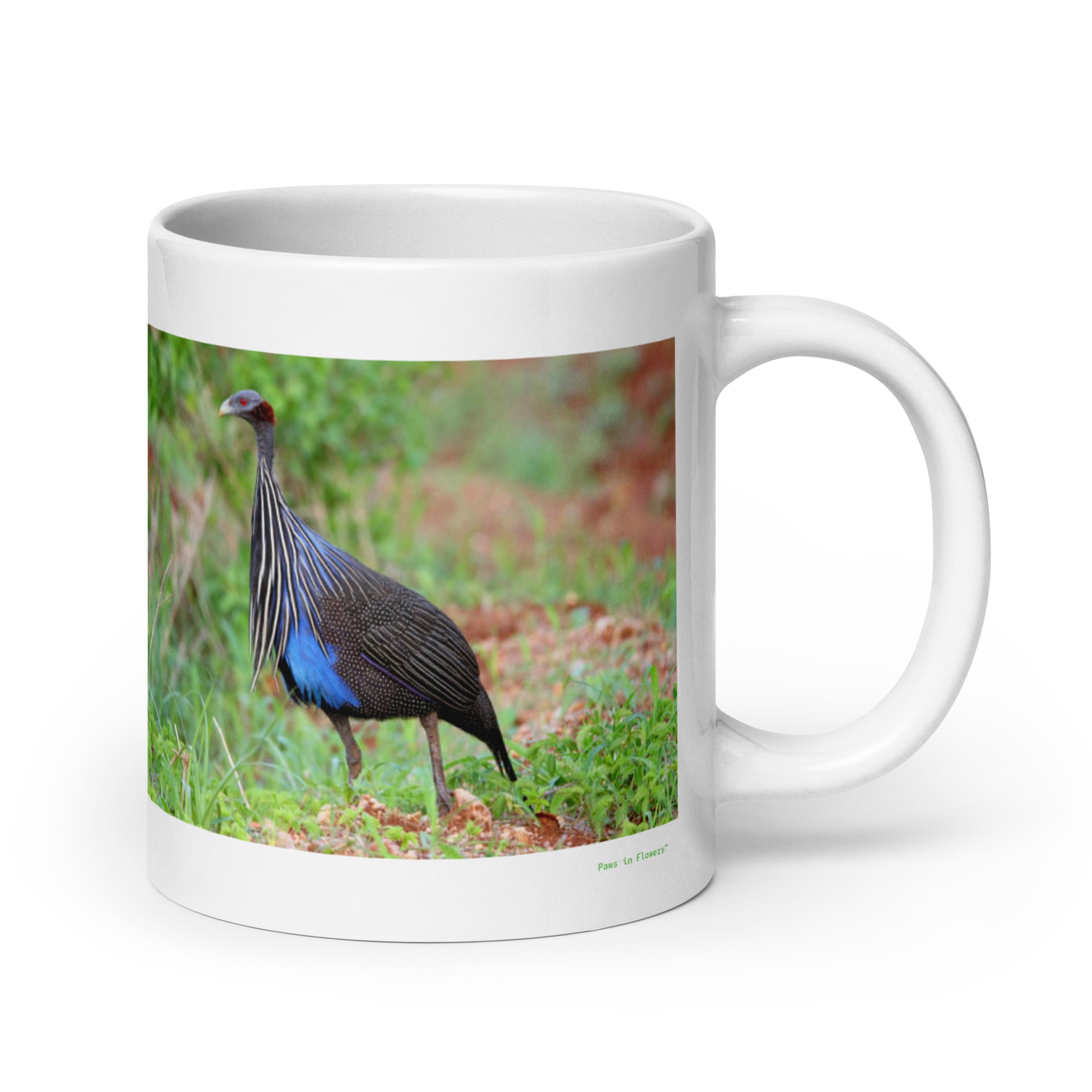 20 oz. white ceramic guinea fowl mug showing a guinea fowl in its natural habitat
