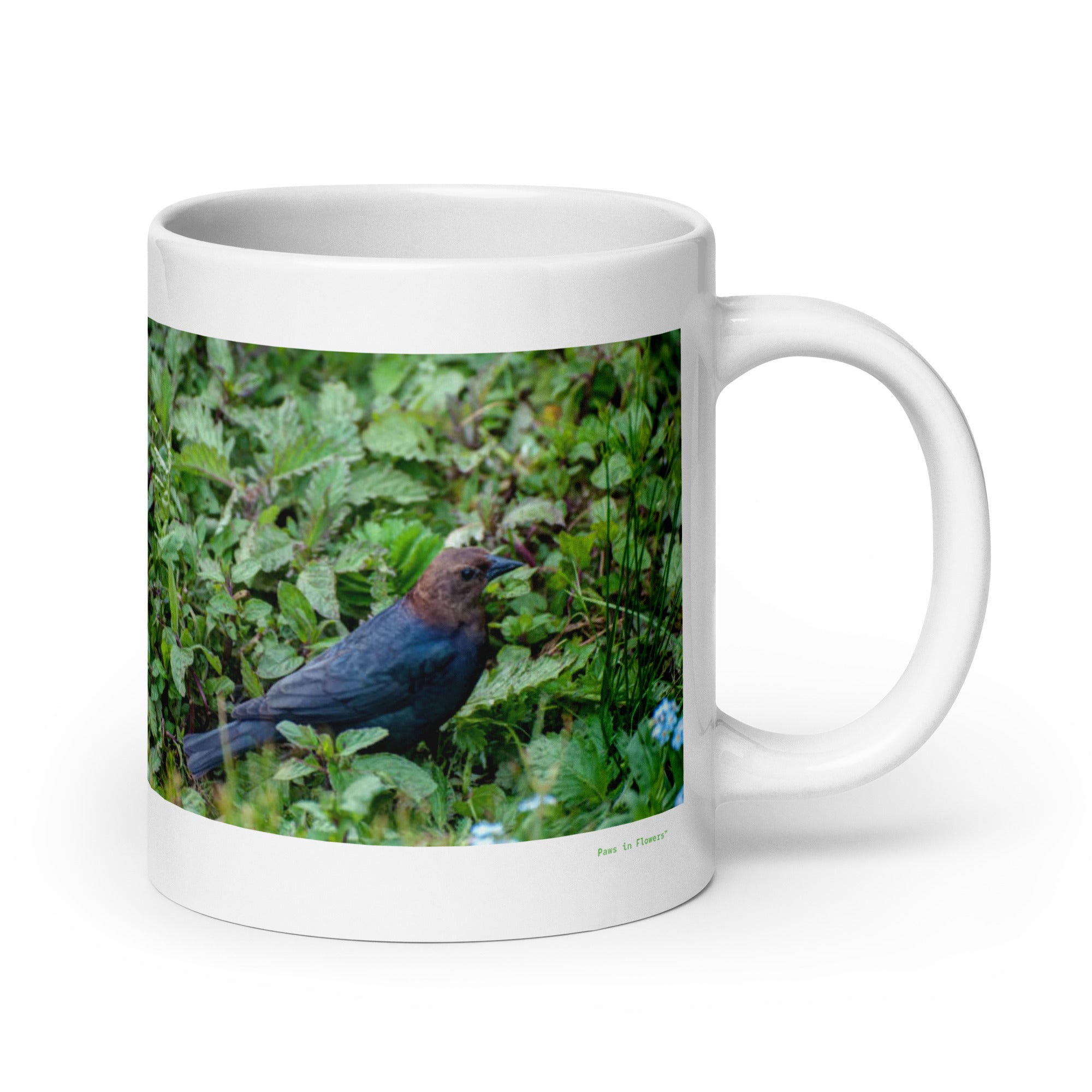 20 oz. white ceramic cowbird  mug showing a cowbird in its natural habitat